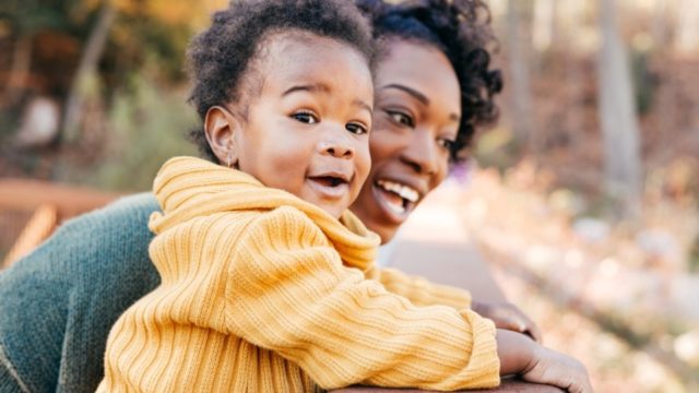 A woman and her child enjoy the outdoors.