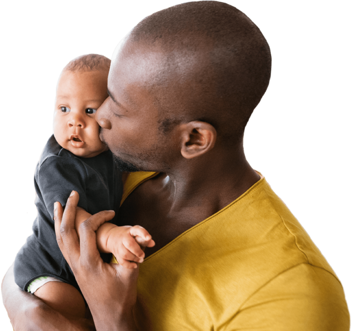 A father kisses his child.