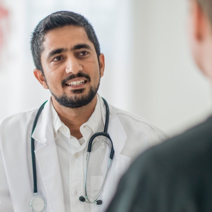 A doctor speaks to a patient.