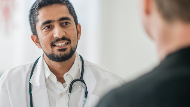 A doctor speaks to a patient.