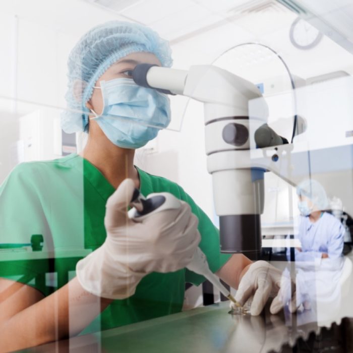 A woman perform medical research.